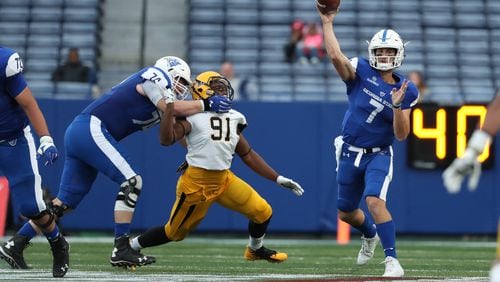 November 25, 2017 - Atlanta, Ga: Georgia State Panthers quarterback Conner Manning (7) attempts a pass as offensive tackle Sebastian Willer (74) blocks Appalachian State Mountaineers defensive lineman Tommy Dawkins (91) in the second half of their game at GSU Stadium Saturday, November 25, 2017, in Atlanta. Appalachian State Mountaineers won 31-10. PHOTO / JASON GETZ