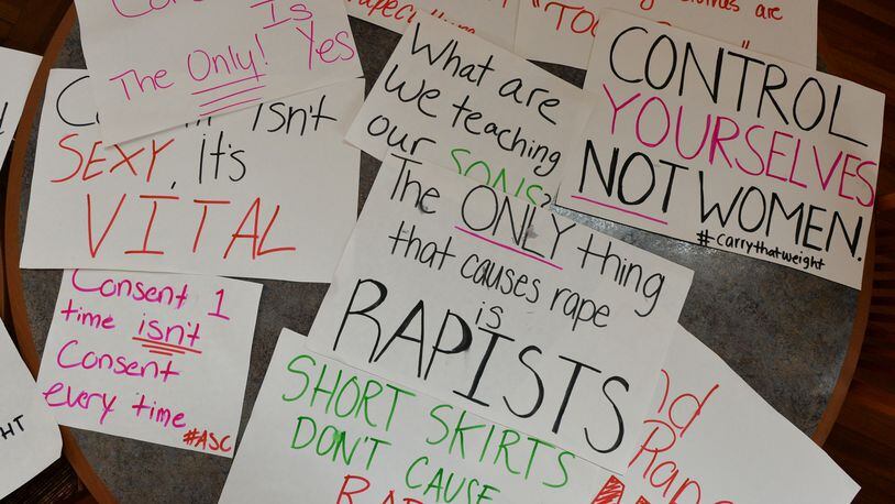 Students at Agnes Scott College show their support for sexual assault victims as part of a 2014 national day of action. BRANT SANDERLIN / BSANDERLIN@AJC.COM
