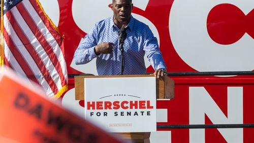 U.S. Senate hopeful Herschel Walker talks to the crowd during a Smyrna rally with Gov. Brian Kemp Saturday, November 19, 2022.   (Steve Schaefer/steve.schaefer@ajc.com)