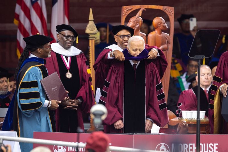 President Joe Biden receives an honorary degree at the commencement ceremony at Morehouse College in Atlanta on Sunday, May 19, 2024. (Arvin Temkar / AJC)