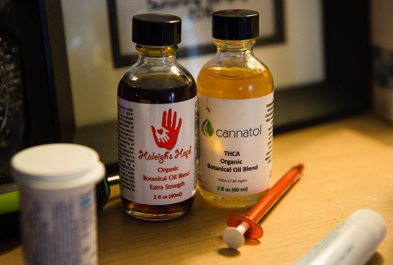 Bottles of cannabis oil that Janea Cox uses to treat her daughter Haleigh, 7, at their home in Forsyth. BITA HONARVAR/SPECIAL