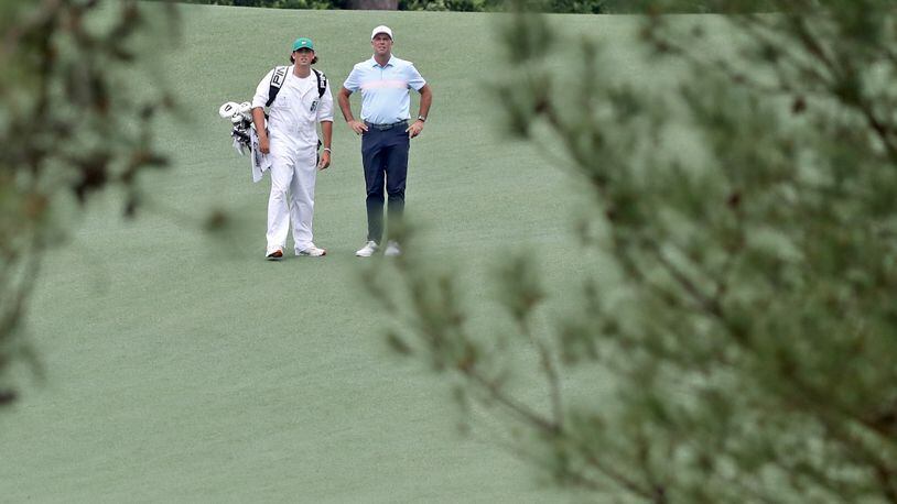 April 10, 2021, Augusta: Stewart Cink and caddie Reagan Cink prepare to hit on the second fairway during the third round of the Masters at Augusta National Golf Club on Saturday, April 10, 2021, in Augusta. Curtis Compton/ccompton@ajc.com