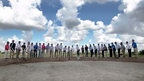 Braves executives,  including chairman and CEO Terry McGuirk (near center in white shirt), joined Sarasota County, North Port and West Villages officials for Monday’s groundbreaking ceremony.