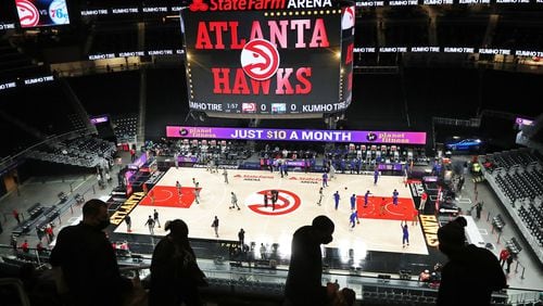 A few fans arrive to watch the Atlanta Hawks play the Philadelphia 76ers Monday, Jan. 11, 2021, at State Farm Arena in Atlanta.  (Curtis Compton / Curtis.Compton@ajc.com)