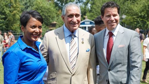 Atlanta Mayor Keisha Lance Bottoms, Falcons owner Arthur Blank and Atlanta Sports Council president Dan Corso participated in a groundbreaking ceremony for a park renovation Wednesday. (Contributed photo by Paul Abell)