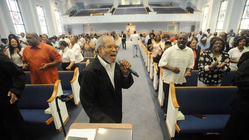Minster Thomas Taylor sings as Hopewell Missionary Baptist Church holds a town hall meeting against gay marriage in Norcross, Friday, June 26, 2015. In a 5-4 ruling, the U.S. Supreme Court ruled Friday that the Constitution requires states to license same-sex marriage and to recognize same-sex marriages lawfully performed elsewhere. KENT D. JOHNSON /KDJOHNSON@AJC.COM