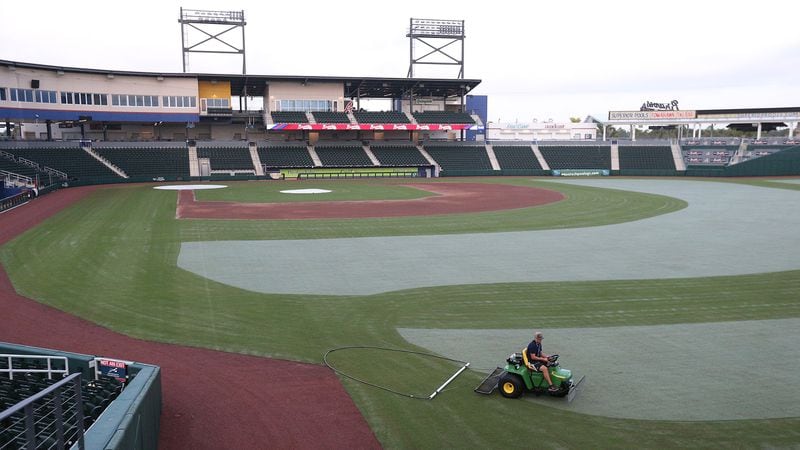 A member of the grounds crew prepares the field at CoolToday Park during the early morning on Feb. 12, 2020, in North Port, Florida.