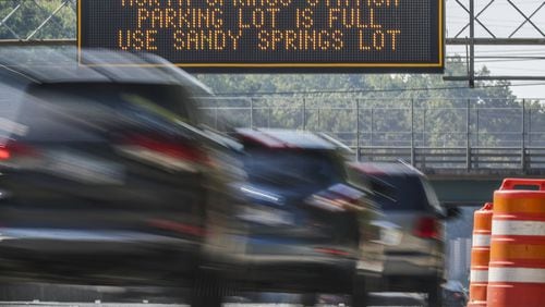 October 3, 2019 Fulton County: A GDOT electronic signboard informs southbound GA 400 commuters that the parking lot is full at the North Springs MARTA Station on Thursday, Oct 3, 2019. MARTA is negotiating with AT&T to buy the parking decks at the busy North Springs station along with Doraville and College Park stations. The lots would open up 2,100 spots to train riders. Those are all the resident-used north and south endpoints of the train. There’s no price, but AT&T has been leasing for land forever. JOHN SPINK/JSPINK@AJC.COM