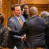 Lt. Gov. Burt Jones (left) greets Sen. Emanuel Jones, D-Decatur, at the Senate in the Capitol in Atlanta on Monday, January 8, 2024, the first day of the legislative session. (Arvin Temkar / arvin.temkar@ajc.com)
