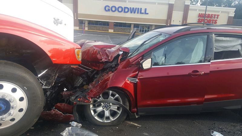 Police believe a woman had a medical episode when she sped into two parked vehicles Saturday.