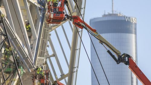 Work underway in November on the $1.5 billion dollar Mercedes-Benz Stadium in downtown Atlanta, one of two major sports projects in the region that have enlarged the rolls of construction workers this year. JOHN SPINK /JSPINK@AJC.COM