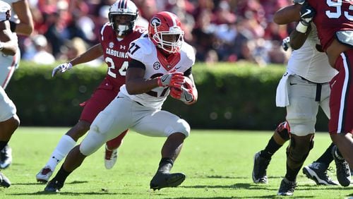 Running back Nick Chubb, in his first full game back from an injury, rushed for both of Georgia’s touchdowns in the first half against South Carolina Sunday. The game was rescheduled from Saturday because of Hurricane Matthew. (Brant Sanderlin / bsanderlin@ajc.com)