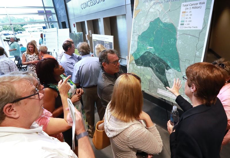 August 19, 2019 Marietta: Concerned area residents crowd around a NATA map of estimated total cancer risk around the Sterigenics site while Cobb officials and environmental regulators hold a town hall and community forum in the wake of reports that Cobb and Fulton have high levels of carcinogenic gas on Monday, August 19, 2019, in Marietta. A user and emitter of the gas, Sterigenics, which sterilizes medical equipment, operates in the area.  Curtis Compton/ccompton@ajc.com