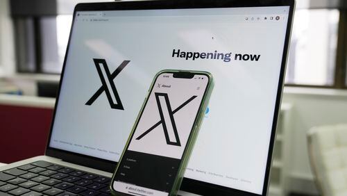 FILE - The opening page of X is displayed on a computer and phone in Sydney on Oct. 16, 2023. An Australian judge on Friday, May 10, 2024, extended a ban on X Corp. sharing videos of an alleged teenage terrorist stabbing a Sydney bishop last month, government lawyers call the social media platform's free speech argument illusory. (AP Photo/Rick Rycroft, File)