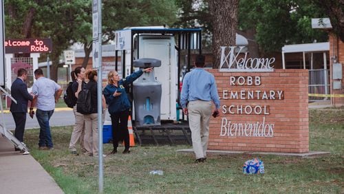 Law enforcement outside Robb Elementary School in Uvalde, Texas, where a gunman killed at least 18 children and a teacher on Tuesday, May 24, 2022. The attack in this rural town west of San Antonio was the deadliest American school shooting since the massacre at Sandy Hook a decade ago. (Christopher Lee/The New York Times)
