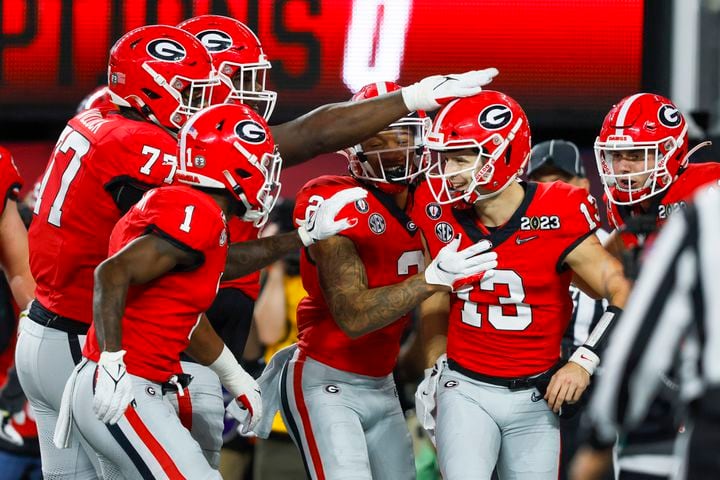 Georgia Bulldogs quarterback Stetson Bennett (13) celebrates a six yard touchdown against the TCU Horned Frogs during the first half of the College Football Playoff National Championship at SoFi Stadium in Los Angeles on Monday, January 9, 2023. (Jason Getz / Jason.Getz@ajc.com)
