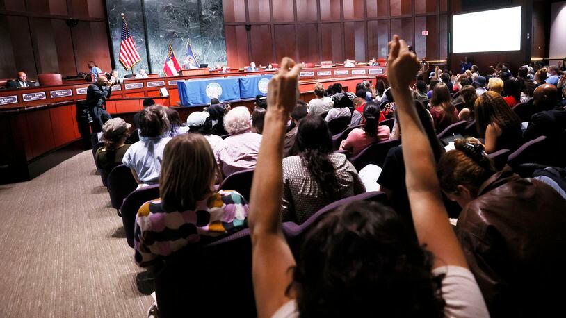 A protester reacts during the public remarks at the Atlanta City Hall as the City Council is set to approve legislation that funds the planned training center. Miguel Martinez /miguel.martinezjimenez@ajc.com