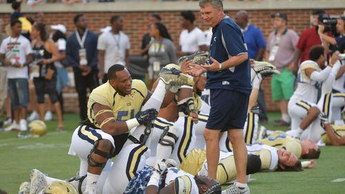 April 21, 2017 Atlanta - Georgia Tech Yellow Jackets head coach Paul Johnson chats with Georgia Tech Yellow Jackets defensive tackle Kyle Cerge-Henderson (54) as he warms up with teammates before 2017 Georgia Tech Football Spring Game at Bobby Dodd Stadium on Friday, April 21, 2017. HYOSUB SHIN / HSHIN@AJC.COM