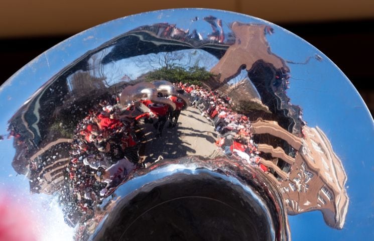 The Dawg Walk is reflected in a sousaphone before the UGA football celebration Saturday, Jan. 14, 2023 in Athens. Ben Gray for the Atlanta Journal-Constitution