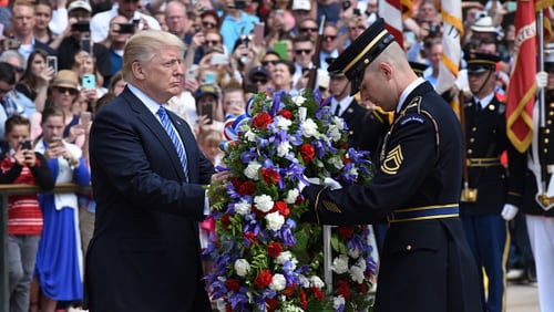 President Donald Trump participates in a wreath-laying ceremony at the Tomb of the Unknown Soldier at Arlington National Cemetery on Memorial Day, May 29, 2017 in Arlington, Virginia.