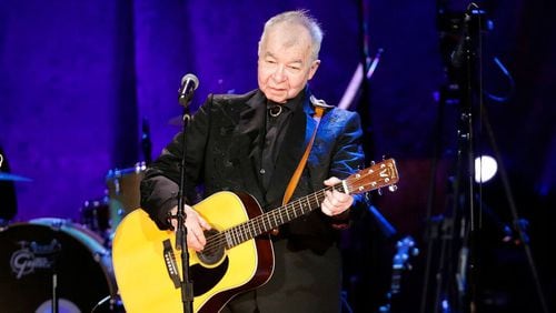 In this Sept. 11, 2019, file photo, John Prine performs at the Americana Honors & Awards show in Nashville, Tenn. Prine died April 7, 2020, from complications of the coronavirus. He was 73. (AP Photo/Wade Payne, File)