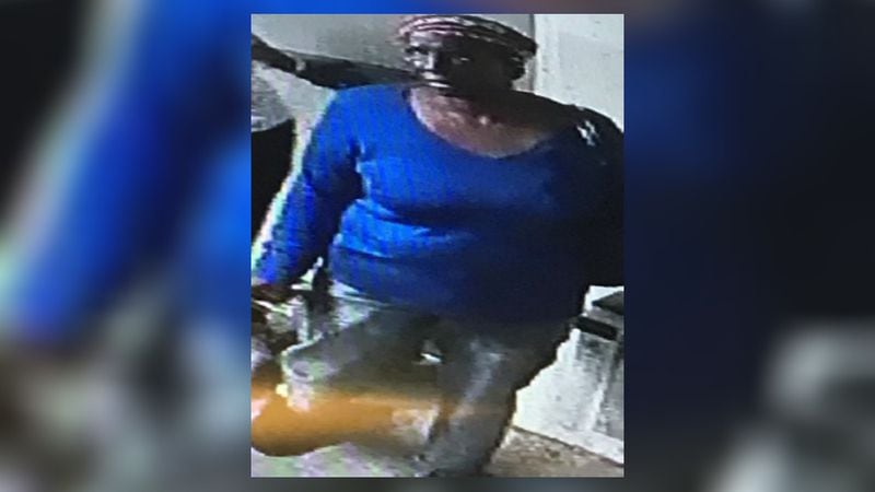 Crime Stoppers Greater Atlanta released a photo of woman seen talking to the gunman right before the shooting. She is described as a person of interest. (Credit: Crime Stoppers Greater Atlanta)