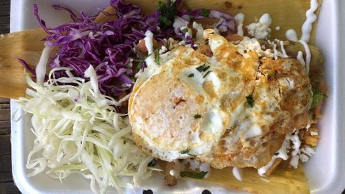 This tamale bowl, with a green pork tamale and all the fixings, is from La Mixteca Tamale House in Gwinnett County. CONTRIBUTED BY WENDELL BROCK