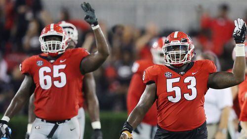 Georgia offensive lineman Kendall Baker and center Lamont Gaillard head into the fourth quarter against Missouri on Saturday, October 14, 2017, in Athens. Curtis Compton/ccompton@ajc.com