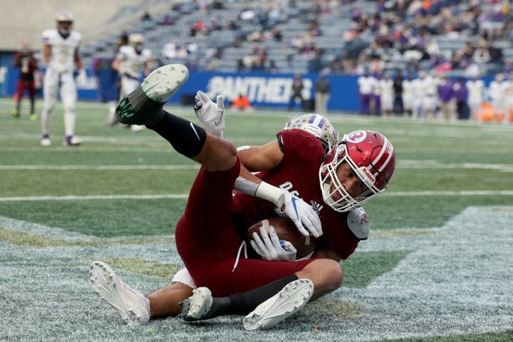 Warner Robins wide receiver Kaleb Howard (7) holds onto the ball for a touchdown reception against Cartersville in the first half of the Class 5A state high school football final at Center Parc Stadium Wednesday, December 30, 2020 in Atlanta. JASON GETZ FOR THE ATLANTA JOURNAL-CONSTITUTION
