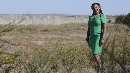 Liza Milagro, the airport’s senior sustainability leader, at the site of the future Green Acres airport composting and recycling facility. The project has been on the drawing board for years but has been slowed by contracting issues. BOB ANDRES /BANDRES@AJC.COM