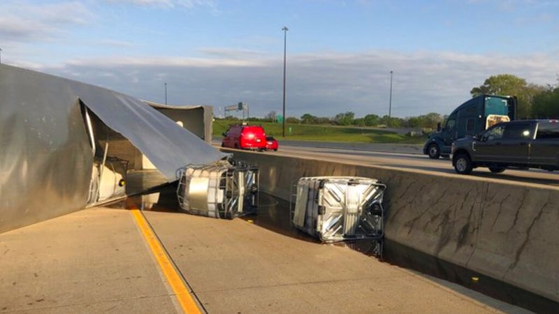 This photo released by the Indiana State Police shows a semi-trailer hauling honey overturned on a northwestern Indiana highway, spilling some of the sticky substance and restricting travel for hours in Hammond, Ind., Wednesday.