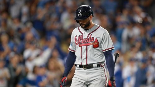 Braves right fielder Nick Markakis reacts after striking out with left fielder Ronald Acuna (not pictured) on third base in the first inning against the Los Angeles Dodgers in Game 2 of a National League Division Series baseball game Friday, October 5, 2018, in Los Angeles. The Dodgers won 3-0. Curtis Compton/ccompton@ajc.com