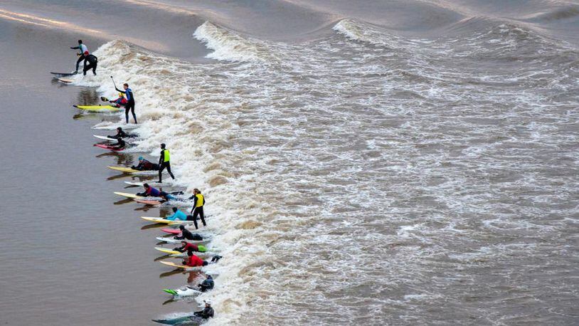 A surfer from Brazil was honored for conquering an 80-foot wave last November in Portugal.