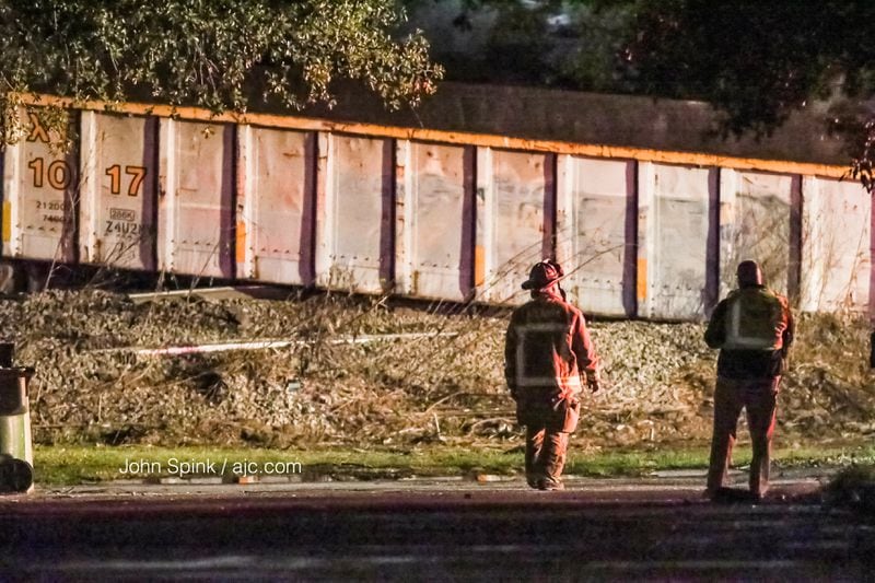A man was injured when a train derailed and crashed into a house in northwest Atlanta early Thursday. JOHN SPINK / JSPINK@AJC.COM