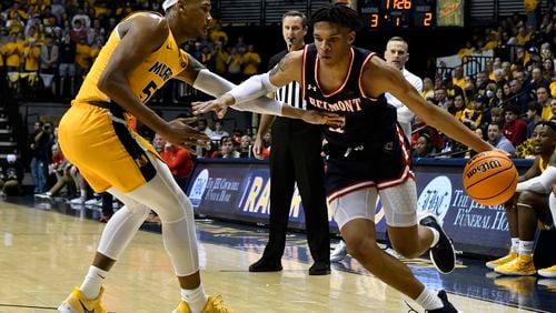 Belmont guard Will Richard (4) attempts to drive past Murray St. forward DJ Burns (55) during the first half of an NCAA college basketball game in Murray, Ky., Thursday, Feb. 24, 2022. (AP Photo/Timothy D. Easley)