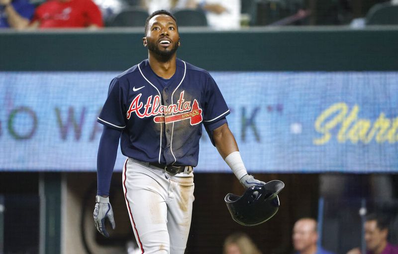 Atlanta Braves' Travis Demeritte walks to the dugout after hitting an inside-the-park home run against the Texas Rangers during the third inning of a baseball game Friday, April 29, 2022, in Arlington, Texas. (AP Photo/Ron Jenkins)