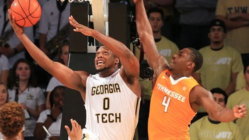 111615 ATLANTA: -- Georgia Tech forward Charles Mitchell goes to the basket for a layup past Tennessee defender Armani Moore during the first half in a basketball game on Monday, Nov. 16, 2015 in Atlanta. Curtis Compton / ccompton@ajc.com