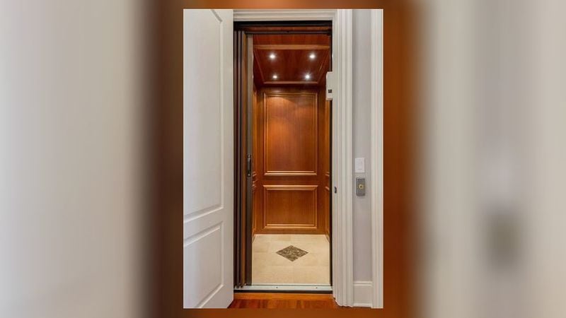A private elevator is included in this gated Decatur home.