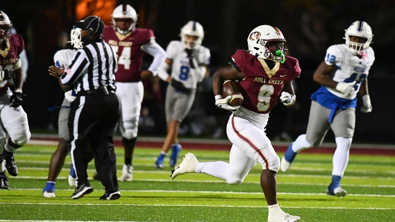 Cameron Robinson runs the ball for Mill Creek during the Westlake vs. Mill Creek High School Football game on Friday, Nov. 25, 2022, at Mill Creek High School in Hoschton, Georgia. (Jamie Spaar for the Atlanta Journal Constitution)