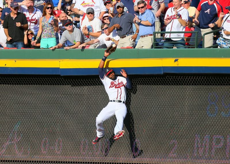 100512 ATLANTA: Atlanta Braves right fielder Jason Heyward (22) makes a leaping catch of St. Louis batter Yadier Molina's pop fly in the second inning of the National League wild card game at Turner Field in Atlanta on Friday, Oct. 5, 2012. CURTIS COMPTON / CCOMPTON@AJC.COM Heyward makes consistently strong throws and all the routine plays, and occasionally some spectacular ones, too.