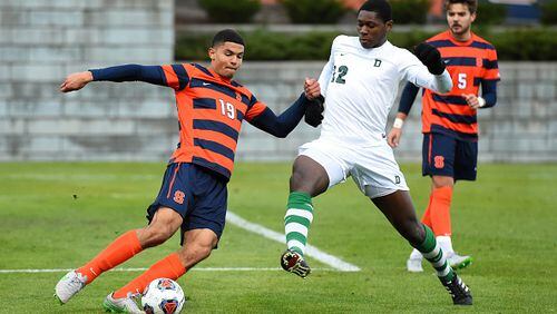 Miles Robinson #19 of the Syracuse Orange controls the ball as Eduvie Ikoba #12 of the Dartmouth Big Green defends during the second half at the SU Soccer Stadium on November 22, 2015 in Syracuse, New York. Syracuse defeated Dartmouth 2-1. (Photo by Rich Barnes/Getty Images)