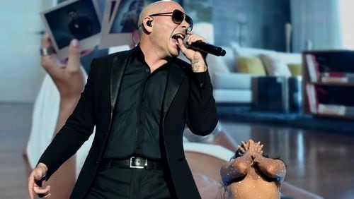Pitbull and Enrique Iglesias will visit Infinite Energy Arena on Sunday. Photo: Getty Images