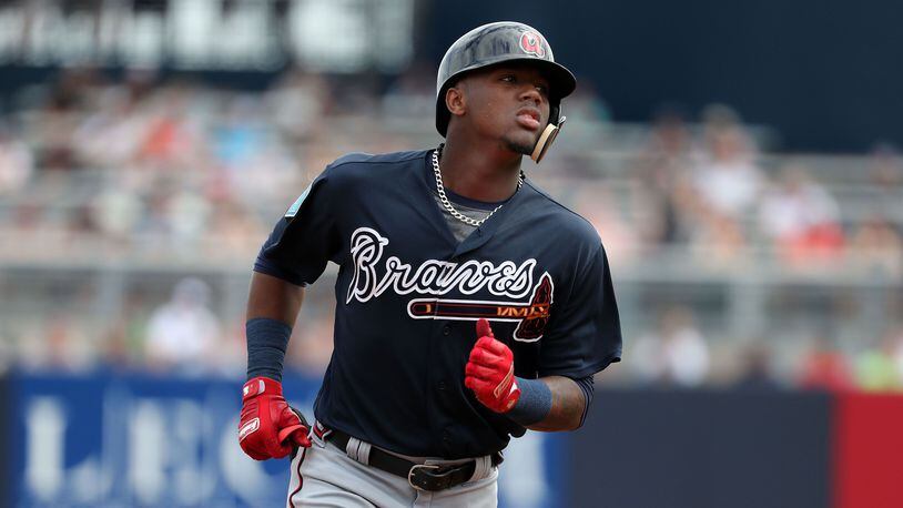Mar 2, 2018; Tampa, FL, USA; Atlanta Braves center fielder Ronald Acuna (82) hits a two run home run during the first inning against the New York Yankees at George M. Steinbrenner Field. Mandatory Credit: Kim Klement-USA TODAY Sports ORG XMIT: USATSI-377941 ORIG FILE ID: 20180302_ggw_sv7_415.JPG