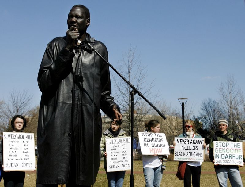 Former NBA star Manute Bol speaks at a rally at the Independence Visitor Center in 2006 as part of the Philadelphia stop of the Sudan Freedom Walk, a 300-mile march from New York to Washington. Bol played 10 seasons in the NBA and later worked with Sudan Sunrise, a humanitarian group that promotes reconciliation in Sudan. (AP Photo/Matt Rourke)
