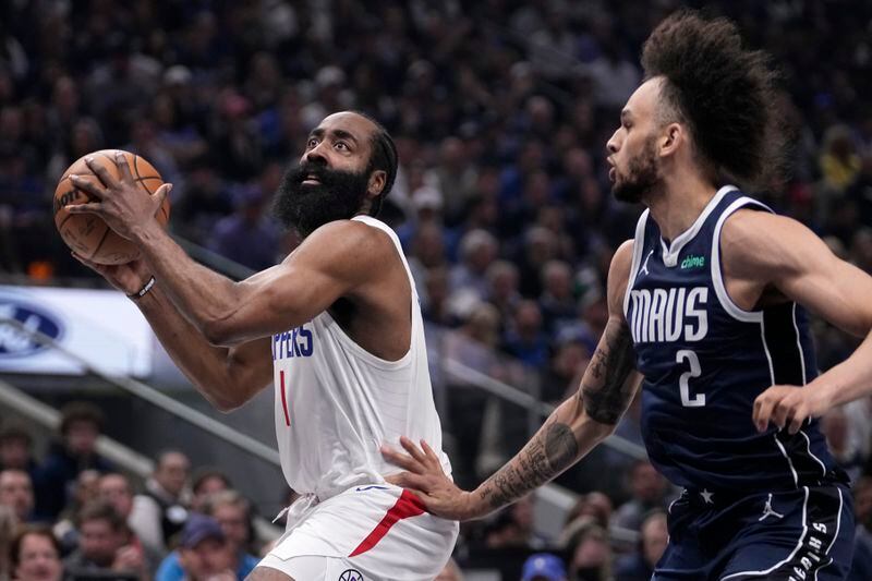 Los Angeles Clippers guard James Harden drives to the basket as Dallas Mavericks' Dereck Lively II (2) defends during the first half in Game 2 of an NBA basketball first-round playoff series Friday, April 26, 2024, in Dallas. (AP Photo/Tony Gutierrez)