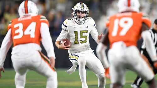 Georgia Tech quarterback Zach Gibson looks for an opening against the Hurricanes during the second half Saturday at Bobby Dodd Stadium. (Daniel Varnado/for The Atlanta Journal-Constitution)