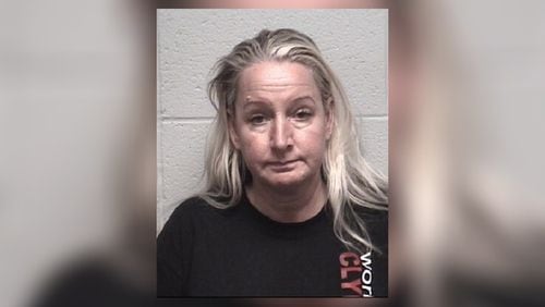 Michelle Louise Root of Gainesville was accused of abusing a dog at her pet grooming business. The dog later died. (AJC file)