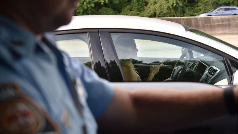 Early evidence suggests stepped-up enforcement and publicity about Georgia’s new distracted-driving law has changed the behavior of some drivers. (HYOSUB SHIN/HSHIN@AJC.COM)