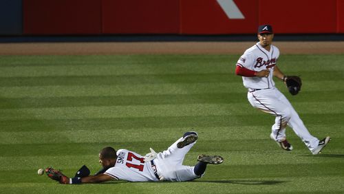 Atlanta Braves center fielder Mallex Smith (17) can't reach a ball hit for an RBI double by Los Angeles Dodgers' Justin Turner in the 10th inning of a baseball game Wednesday, April 20, 2016, in Atlanta. The Dodgers won 5-3 in 10 innings. (AP Photo/John Bazemore)