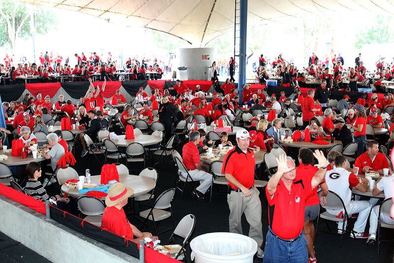 A sea of red fills the massive tent for the annual BBQ Tailgate Party hosted by the Georgia Bulldog Club of Jacksonville just before the Georgia-Florida game in Jacksonville. Contributed by Bill Graham